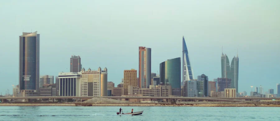 The national flag and an office consultation illustration for company formation in Bahrain.